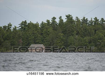 Stock Photograph - Cabin along shoreline at Lake of the Woods, Ontario. Fotosearch