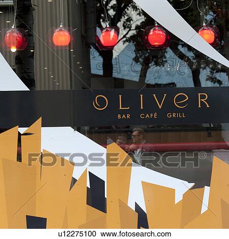 Stock Image - Cafe storefront window, hanging light fixtures. Fotosearch