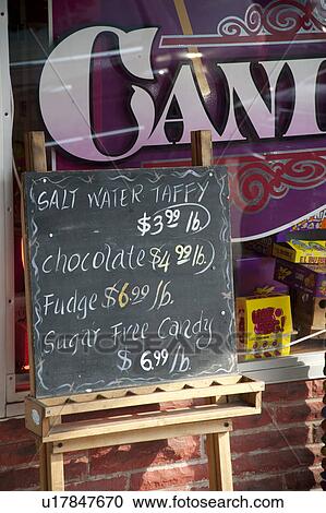 stock photography of candy store sign in downtown historic district