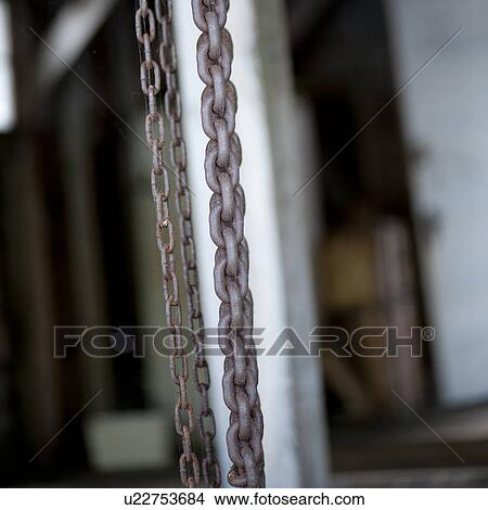 Chains hanging on a wall View Large Photo Image Picture - Chains hanging on a wall. Fotosearch