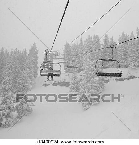 Chairlift on a ski slope in Vail, Colorado View Large Photo Image Picture - Chairlift on a ski slope in Vail, Colorado. Fotosearch