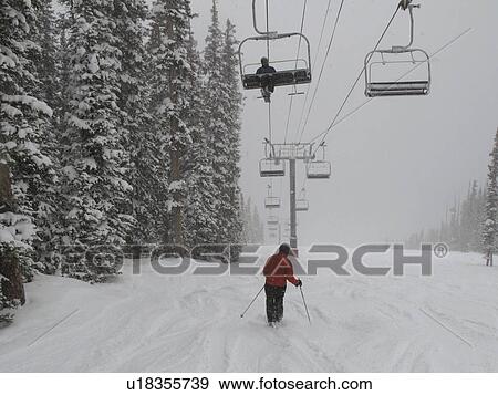 Chairlift on a ski slope in Vail, Colorado View Large Photo Image Stock Photo - Chairlift on a ski slope in Vail, Colorado. Fotosearch