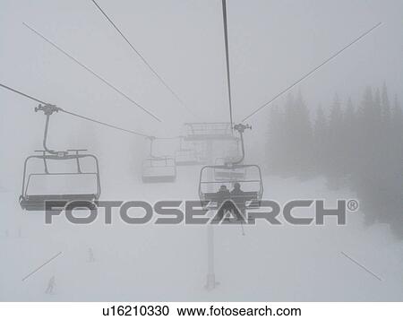 Stock Image - Chairlift on the slopes in Vail, Colorado. Fotosearch