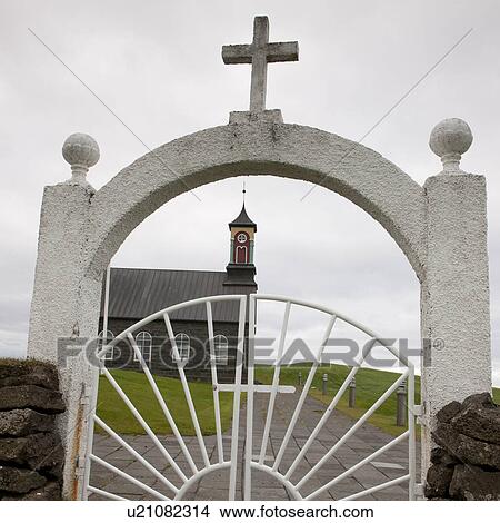 Christian church through iron gate View Large Photo Image Picture - Christian church through iron gate. Fotosearch