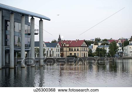 Stock Photo - City Hall, Reykjavik harbour, reflections in the ocean water. Fotosearch