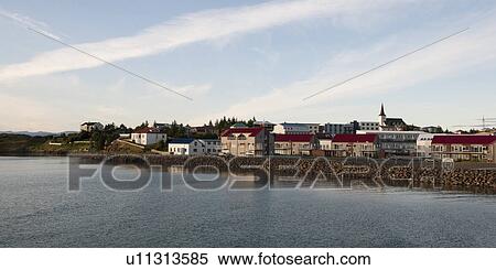 Cityscape, dwellings and steeple on river bank View Large Photo Image Stock Photography - Cityscape, dwellings and steeple on river bank. Fotosearch