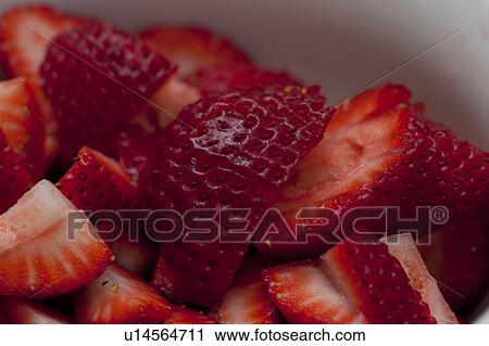 Close up of a pile of sliced red strawberries View Large Photo Image Stock Image - Close up of a pile of sliced red strawberries. Fotosearch