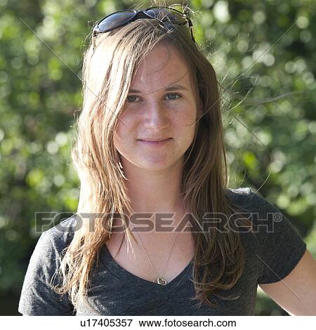 Close up of a young adult woman with long hair View Large Photo Image Stock Photo - Close up of a young adult woman with long hair. Fotosearch
