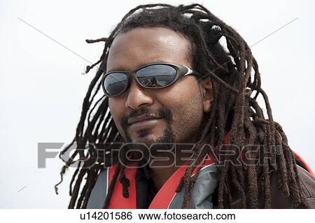 Close up of an Africian American man wearing sunglasses View Large Photo Image Stock Photograph - Close up of an Africian American man wearing sunglasses. Fotosearch