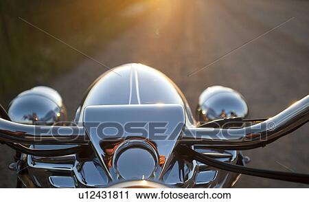 Stock Image - Close up of the handlebars of a motorcycle. Fotosearch