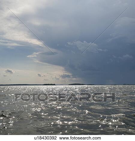 Stock Image - Cloud in the horizon sky over Lake of the Woods, Ontario. Fotosearch