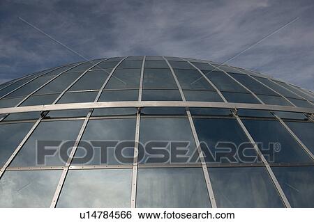 Stock Photograph - Cloud reflective glass and aluminum dome, the Pearl, Reykjavik. Fotosearch