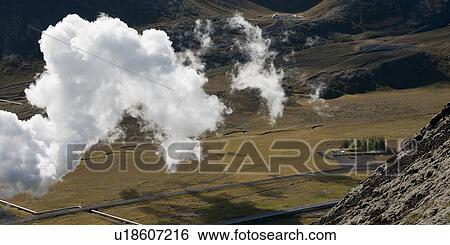 Clouds floating past rocky hillside over farmland valley View Large Photo Image Stock Photograph - Clouds floating past rocky hillside over farmland valley. Fotosearch