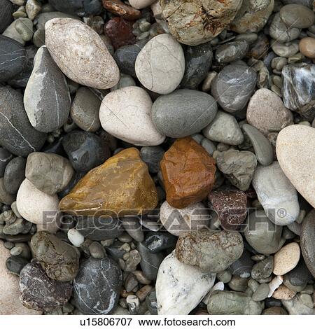 Stock Photo - Colourful stones along shoreline in Costa Rica. Fotosearch