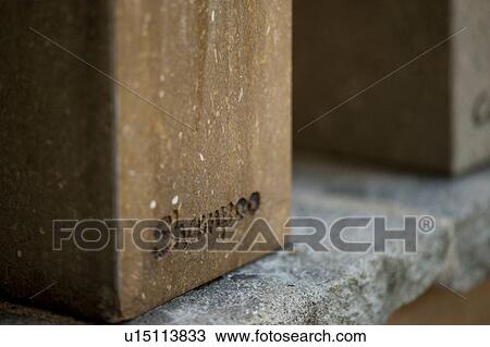 Stock Image - Cube stone bathroom shampoo dispenser . Fotosearch