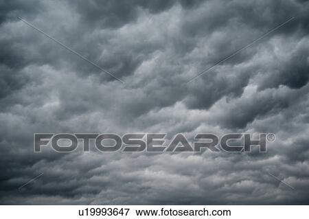 Stock Photo - Dark storm clouds in the sky over Lake of the Woods, Ontario. Fotosearch