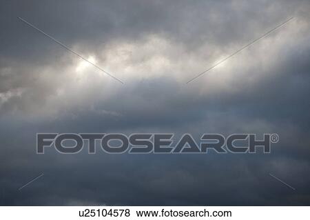 Stock Photo - Dark storm clouds in the sky over Lake of the Woods, Ontario. Fotosearch