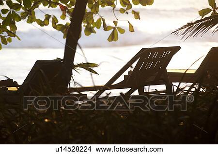 Deckchairs along Mal Pais coastline in San Jose Costa Rica View Large Photo Image Picture - Deckchairs along Mal Pais coastline in San Jose Costa Rica. Fotosearch