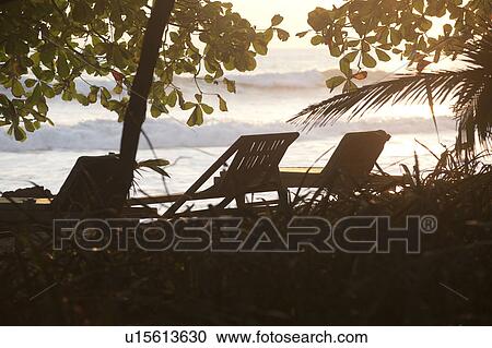 Deckchairs along Mal Pais coastline in San Jose Costa Rica View Large Photo Image Stock Image - Deckchairs along Mal Pais coastline in San Jose Costa Rica. Fotosearch