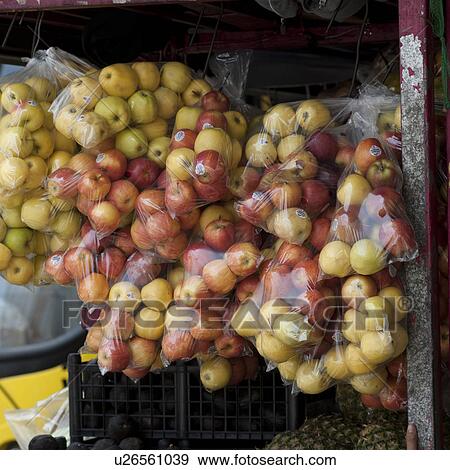 Stock Photo - Display of bags of apples in San Jose Costa Rica. Fotosearch