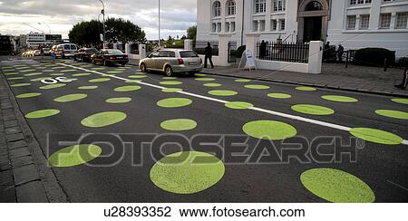Dotted roadway in Reykjavik with traffic and apartment building View Large Photo Image Stock Image - Dotted roadway in Reykjavik with traffic and apartment building. Fotosearch