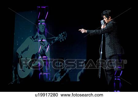 Stock Image - Elvis Presley impersonater performing in Branson, Missouri, U. S. A.. Fotosearch