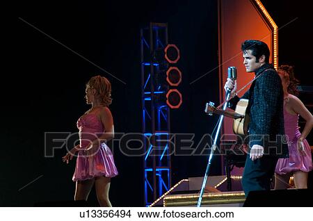Picture - Elvis Presley impersonator performing in Branson, Missouri, U. S. A.. Fotosearch