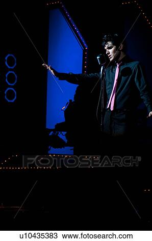 Elvis Presley impersonator performing in Branson, Missouri, U. S. A. View Large Photo Image Stock Image - Elvis Presley impersonator performing in Branson, Missouri, U. S. A.. Fotosearch
