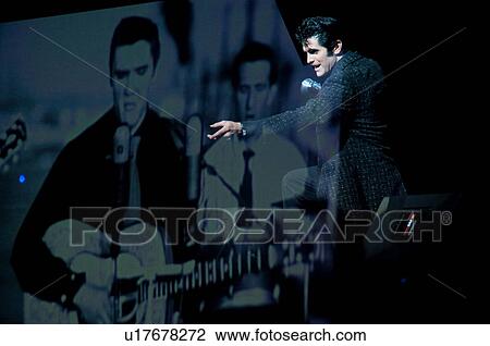 Stock Image - Elvis Presley impersonator performing in Branson, Missouri, U. S. A.. Fotosearch