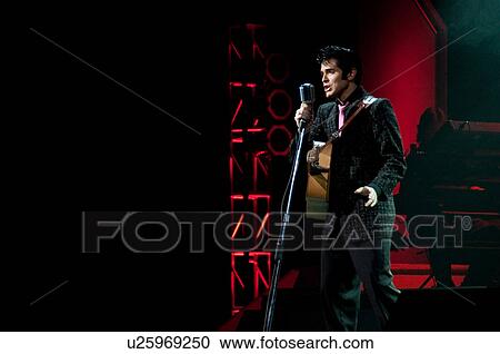 Stock Image - Elvis Presley impersonator performing in Branson, Missouri, U. S. A.. Fotosearch