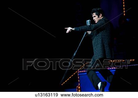 Elvis Presley impersonator performing in Branson, Missouri, U. S. A. View Large Photo Image Stock Photo - Elvis Presley impersonator performing in Branson, Missouri, U. S. A.. Fotosearch