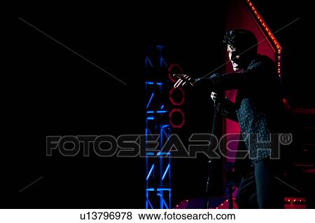 Elvis Presley impersonator performing in Branson, Missouri, U. S. Ao View Large Photo Image Stock Photo - Elvis Presley impersonator performing in Branson, Missouri, U. S. Ao. Fotosearch