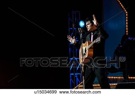 Stock Photo - Elvis Presley impersonator performing in Branson, Missouri, U. S. A.. Fotosearch