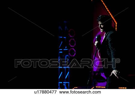 Elvis Presley impersonator performing in Branson, Missouri, U. S. Ao View Large Photo Image Stock Photo - Elvis Presley impersonator performing in Branson, Missouri, U. S. Ao. Fotosearch
