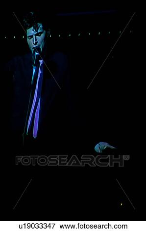 Stock Photo - Elvis Presley impersonator performing in Branson, Missouri, U. S. A.. Fotosearch