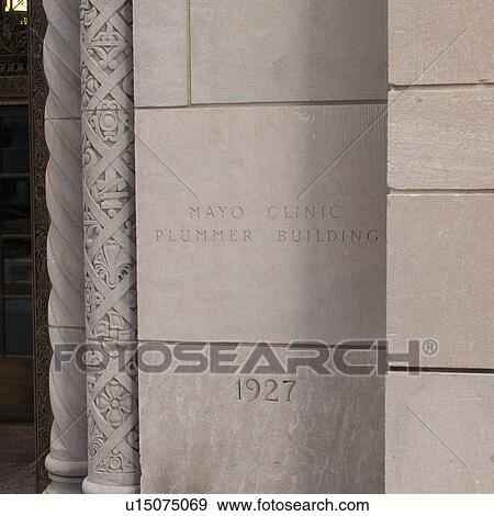 Stock Photo - Engraved wall at Mayo Clinic, Plummer building in Rochester, Minnesota, USA. Fotosearch