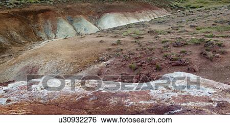 Stock Photograph - Eroded colourful volcanic mineral rich gully . Fotosearch