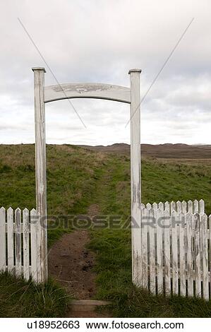 Stock Image - Fence and archway in rural Iceland. Fotosearch