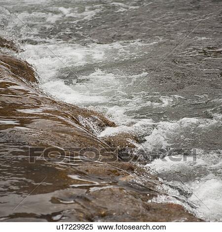 Stock Photography - Flow of river in Vail, Colorado. Fotosearch