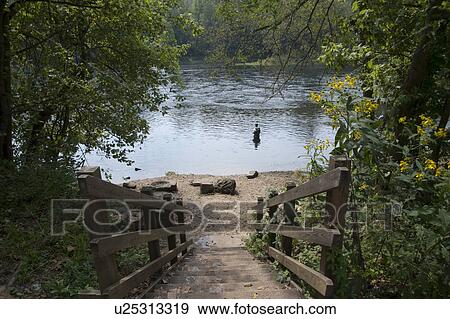 Stock Photo - Fly fishing at lake Taneycomo in Branson, Missouri. Fotosearch