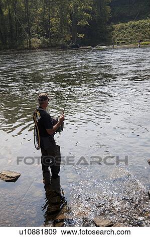 Stock Photo - Fly fishing in lake Taneycomo in Branson, Missouri. Fotosearch