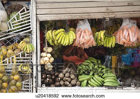 Fruit and vegatable stand, with banans, carrots, onions, melons, View Large Photo Image Stock Image - Fruit and vegatable stand, with banans, carrots, onions, melons, . Fotosearch