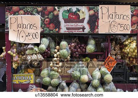 Fruit and vegetable market stall with melons, onions, pineapple, apples, papaya View Large Photo Image Picture - Fruit and vegetable market stall with melons, onions, pineapple, apples, papaya. Fotosearch