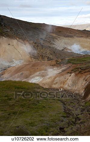Stock Image - Geological geothermal mineral pool vents in Iceland. Fotosearch