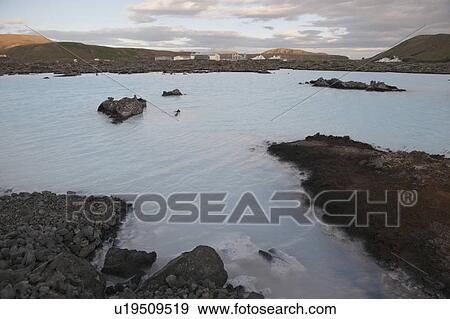 Geothermal power factory, surrounded by rocky landscape with a lake View Large Photo Image Stock Photo - Geothermal power factory, surrounded by rocky landscape with a lake. Fotosearch