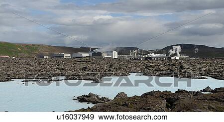 Stock Photo - Geothermal power plant, factory buildings, and a volcanic rock lagoon. Fotosearch
