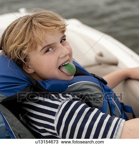 Girl sticking out her green stained tongue View Large Photo Image Stock Image - Girl sticking out her green stained tongue. Fotosearch