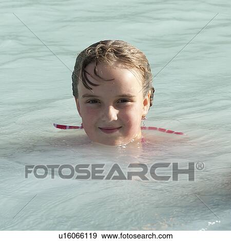 Stock Photo - Girl swimming in mineral pool. Fotosearch