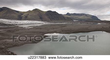 Stock Image - Glacial mountain coastline. Fotosearch