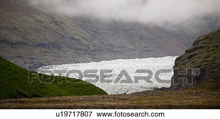 Glacier terminus in rugged mountain valley View Large Photo Image Stock Photo - Glacier terminus in rugged mountain valley. Fotosearch